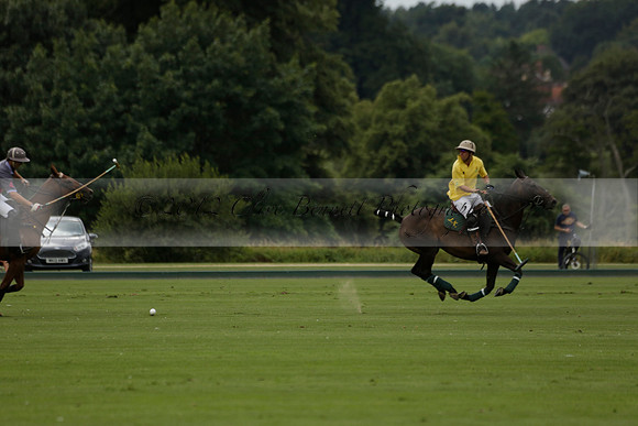 La Tremenda (lilac) v Maiz Dulce (yellow) in a Brecknock Cup polo match played on Lawns 1 at the Cowdray Park Polo Club on Tuesday 13 August 2013