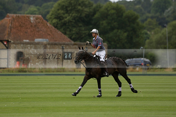La Tremenda (lilac) v Maiz Dulce (yellow) in a Brecknock Cup polo match played on Lawns 1 at the Cowdray Park Polo Club on Tuesday 13 August 2013