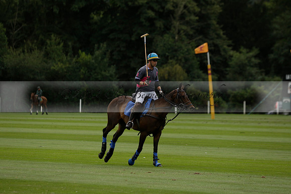 La Tremenda (lilac) v Maiz Dulce (yellow) in a Brecknock Cup polo match played on Lawns 1 at the Cowdray Park Polo Club on Tuesday 13 August 2013