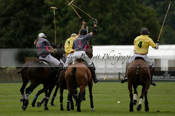 La Tremenda (lilac) v Maiz Dulce (yellow) in a Brecknock Cup polo match played on Lawns 1 at the Cowdray Park Polo Club on Tuesday 13 August 2013