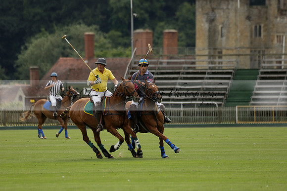 La Tremenda (lilac) v Maiz Dulce (yellow) in a Brecknock Cup polo match played on Lawns 1 at the Cowdray Park Polo Club on Tuesday 13 August 2013