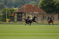 La Tremenda (lilac) v Maiz Dulce (yellow) in a Brecknock Cup polo match played on Lawns 1 at the Cowdray Park Polo Club on Tuesday 13 August 2013