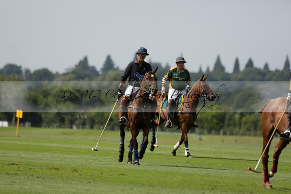 Maiz Dulce (green) v River (blue) in a Uber Polo Midsummer 12 goal polo match on Wednesday 21 August 2013 at Cowdray park Polo Club on Ambersham 2.  www.polopictures.co.uk