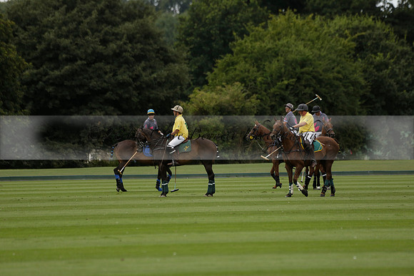 La Tremenda (lilac) v Maiz Dulce (yellow) in a Brecknock Cup polo match played on Lawns 1 at the Cowdray Park Polo Club on Tuesday 13 August 2013