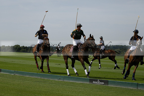 Maiz Dulce (green) v River (blue) in a Uber Polo Midsummer 12 goal polo match on Wednesday 21 August 2013 at Cowdray park Polo Club on Ambersham 2.  www.polopictures.co.uk