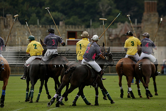 La Tremenda (lilac) v Maiz Dulce (yellow) in a Brecknock Cup polo match played on Lawns 1 at the Cowdray Park Polo Club on Tuesday 13 August 2013