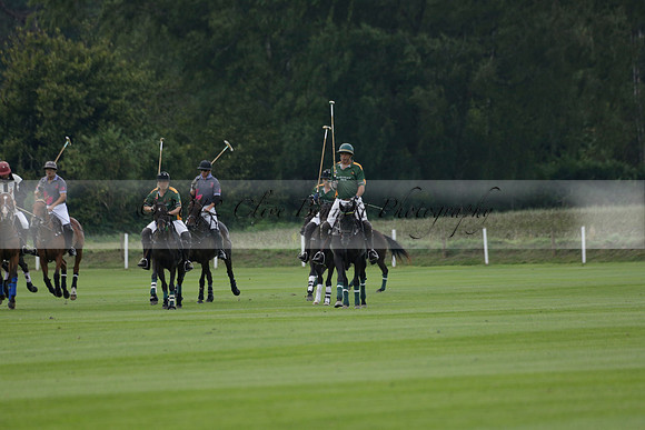 La Tremenda (mauve) v Maiz Dulce (green) in the Brecknock Cup  final polo match. Played at Cowdray Park Polo Club on Sunday 25 August 2013 on Ambersham 1. www.polopictures.co.uk