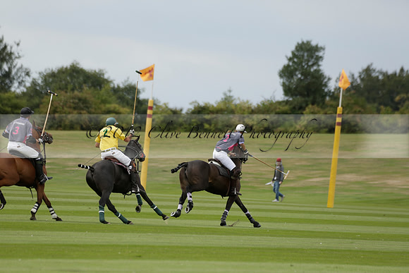 La Tremenda (lilac) v Maiz Dulce (yellow) in a Brecknock Cup polo match played on Lawns 1 at the Cowdray Park Polo Club on Tuesday 13 August 2013