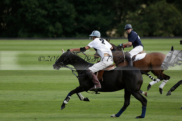 Pandas (white) v Home Farm (navy) in a Park House West Sussex Cup Polo match on Brooksfield at Cowdray Park Polo Club on Friday 30 August 2013. 2013.08.30 www.polopictures.co.uk