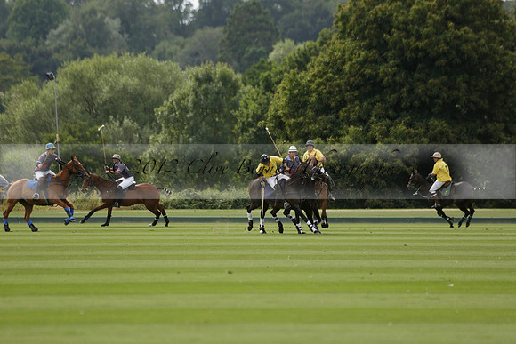 La Tremenda (lilac) v Maiz Dulce (yellow) in a Brecknock Cup polo match played on Lawns 1 at the Cowdray Park Polo Club on Tuesday 13 August 2013