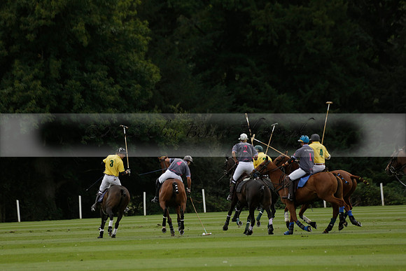La Tremenda (lilac) v Maiz Dulce (yellow) in a Brecknock Cup polo match played on Lawns 1 at the Cowdray Park Polo Club on Tuesday 13 August 2013