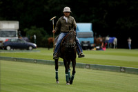 La Tremenda (lilac) v Maiz Dulce (yellow) in a Brecknock Cup polo match played on Lawns 1 at the Cowdray Park Polo Club on Tuesday 13 August 2013