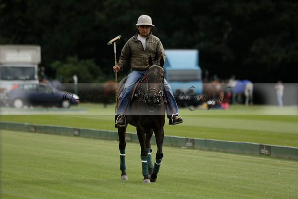 La Tremenda (lilac) v Maiz Dulce (yellow) in a Brecknock Cup polo match played on Lawns 1 at the Cowdray Park Polo Club on Tuesday 13 August 2013