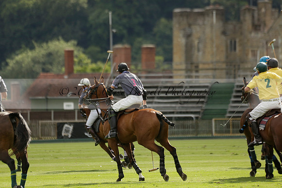 La Tremenda (lilac) v Maiz Dulce (yellow) in a Brecknock Cup polo match played on Lawns 1 at the Cowdray Park Polo Club on Tuesday 13 August 2013