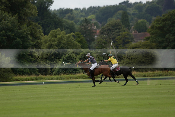 La Tremenda (lilac) v Maiz Dulce (yellow) in a Brecknock Cup polo match played on Lawns 1 at the Cowdray Park Polo Club on Tuesday 13 August 2013