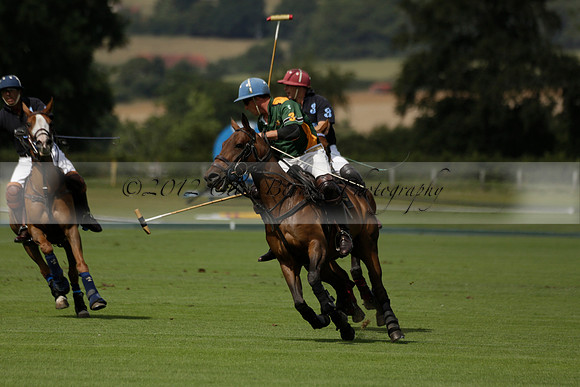 Maiz Dulce (green) v River (blue) in a Uber Polo Midsummer 12 goal polo match on Wednesday 21 August 2013 at Cowdray park Polo Club on Ambersham 2.  www.polopictures.co.uk