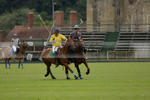 La Tremenda (lilac) v Maiz Dulce (yellow) in a Brecknock Cup polo match played on Lawns 1 at the Cowdray Park Polo Club on Tuesday 13 August 2013
