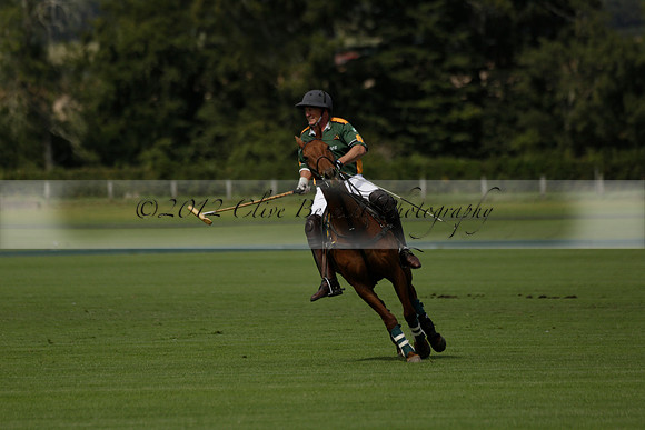 Maiz Dulce (green) v River (blue) in a Uber Polo Midsummer 12 goal polo match on Wednesday 21 August 2013 at Cowdray park Polo Club on Ambersham 2.  www.polopictures.co.uk