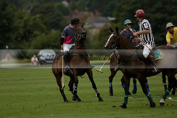 La Tremenda (lilac) v Maiz Dulce (yellow) in a Brecknock Cup polo match played on Lawns 1 at the Cowdray Park Polo Club on Tuesday 13 August 2013