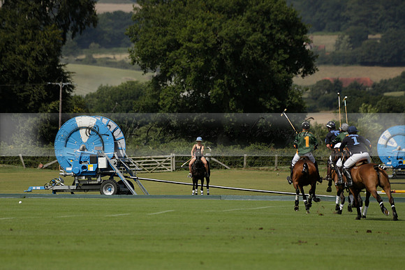 Maiz Dulce (green) v River (blue) in a Uber Polo Midsummer 12 goal polo match on Wednesday 21 August 2013 at Cowdray park Polo Club on Ambersham 2.  www.polopictures.co.uk
