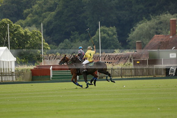 La Tremenda (lilac) v Maiz Dulce (yellow) in a Brecknock Cup polo match played on Lawns 1 at the Cowdray Park Polo Club on Tuesday 13 August 2013