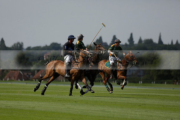 Maiz Dulce (green) v River (blue) in a Uber Polo Midsummer 12 goal polo match on Wednesday 21 August 2013 at Cowdray park Polo Club on Ambersham 2.  www.polopictures.co.uk