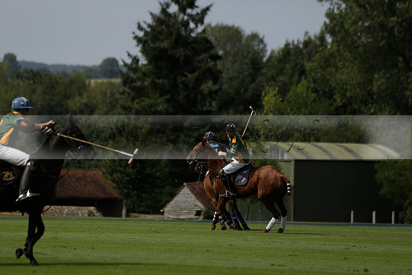 Maiz Dulce (green) v River (blue) in a Uber Polo Midsummer 12 goal polo match on Wednesday 21 August 2013 at Cowdray park Polo Club on Ambersham 2.  www.polopictures.co.uk