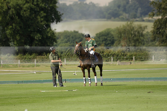 Maiz Dulce (green) v River (blue) in a Uber Polo Midsummer 12 goal polo match on Wednesday 21 August 2013 at Cowdray park Polo Club on Ambersham 2.  www.polopictures.co.uk