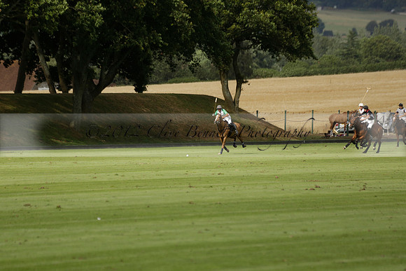 Jaeger Le Coultre (black)  v Wairakei Pastoral (white) in a Jaeger Le Coultre Holden White Cup polo match played on 29 July 2013 at Cowdray Park Polo Club on Brooksfieldwww.polopictures.co.uk