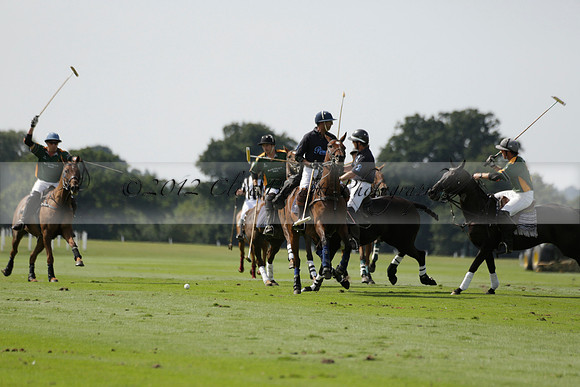 Maiz Dulce (green) v River (blue) in a Uber Polo Midsummer 12 goal polo match on Wednesday 21 August 2013 at Cowdray park Polo Club on Ambersham 2.  www.polopictures.co.uk