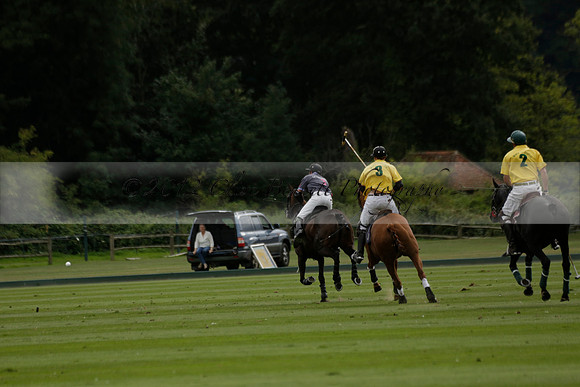 La Tremenda (lilac) v Maiz Dulce (yellow) in a Brecknock Cup polo match played on Lawns 1 at the Cowdray Park Polo Club on Tuesday 13 August 2013