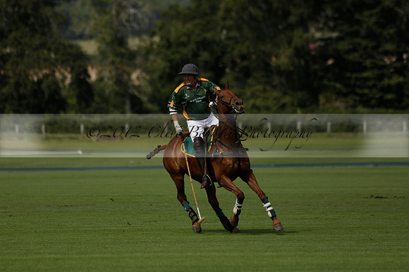 Maiz Dulce (green) v River (blue) in a Uber Polo Midsummer 12 goal polo match on Wednesday 21 August 2013 at Cowdray park Polo Club on Ambersham 2.  www.polopictures.co.uk