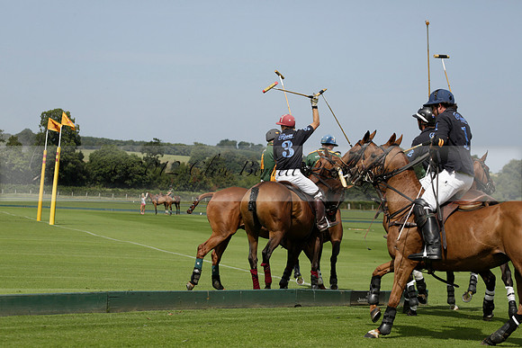 Maiz Dulce (green) v River (blue) in a Uber Polo Midsummer 12 goal polo match on Wednesday 21 August 2013 at Cowdray park Polo Club on Ambersham 2.  www.polopictures.co.uk