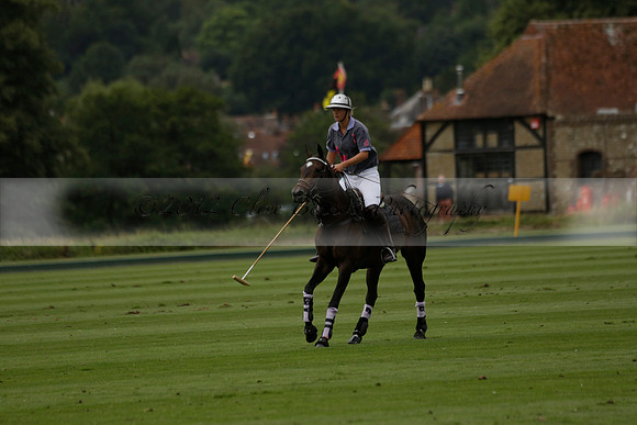 La Tremenda (lilac) v Maiz Dulce (yellow) in a Brecknock Cup polo match played on Lawns 1 at the Cowdray Park Polo Club on Tuesday 13 August 2013