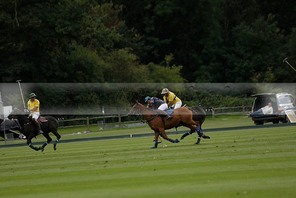 La Tremenda (lilac) v Maiz Dulce (yellow) in a Brecknock Cup polo match played on Lawns 1 at the Cowdray Park Polo Club on Tuesday 13 August 2013