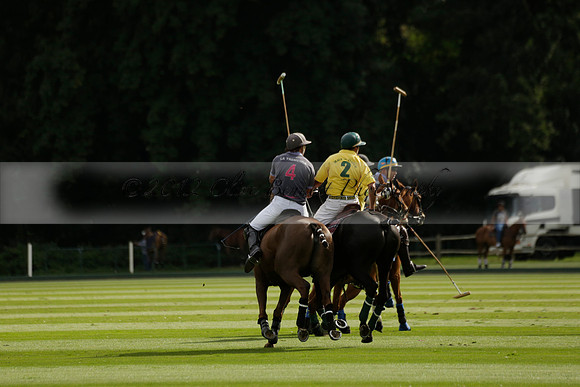 La Tremenda (lilac) v Maiz Dulce (yellow) in a Brecknock Cup polo match played on Lawns 1 at the Cowdray Park Polo Club on Tuesday 13 August 2013