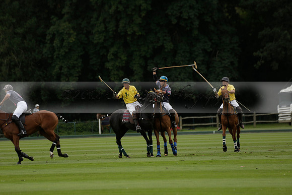 La Tremenda (lilac) v Maiz Dulce (yellow) in a Brecknock Cup polo match played on Lawns 1 at the Cowdray Park Polo Club on Tuesday 13 August 2013