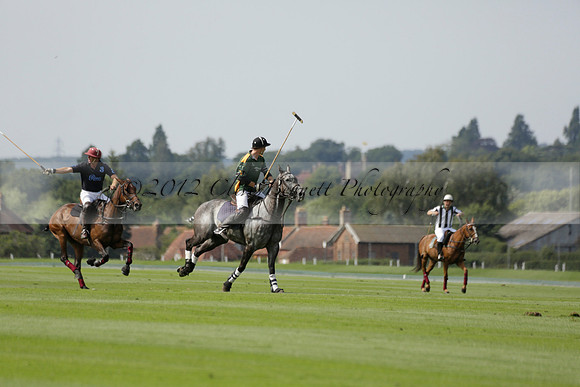 Maiz Dulce (green) v River (blue) in a Uber Polo Midsummer 12 goal polo match on Wednesday 21 August 2013 at Cowdray park Polo Club on Ambersham 2.  www.polopictures.co.uk