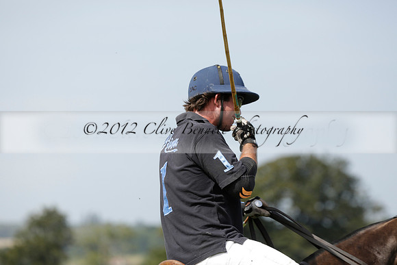 Maiz Dulce (green) v River (blue) in a Uber Polo Midsummer 12 goal polo match on Wednesday 21 August 2013 at Cowdray park Polo Club on Ambersham 2.  www.polopictures.co.uk