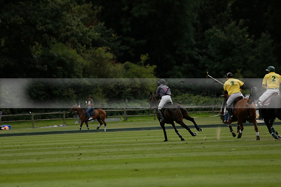La Tremenda (lilac) v Maiz Dulce (yellow) in a Brecknock Cup polo match played on Lawns 1 at the Cowdray Park Polo Club on Tuesday 13 August 2013