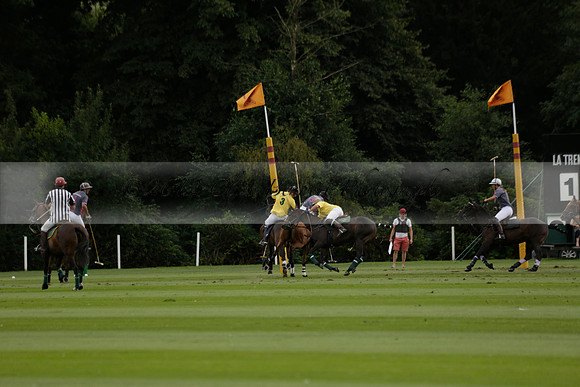 La Tremenda (lilac) v Maiz Dulce (yellow) in a Brecknock Cup polo match played on Lawns 1 at the Cowdray Park Polo Club on Tuesday 13 August 2013