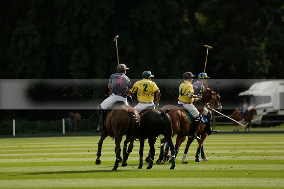 La Tremenda (lilac) v Maiz Dulce (yellow) in a Brecknock Cup polo match played on Lawns 1 at the Cowdray Park Polo Club on Tuesday 13 August 2013