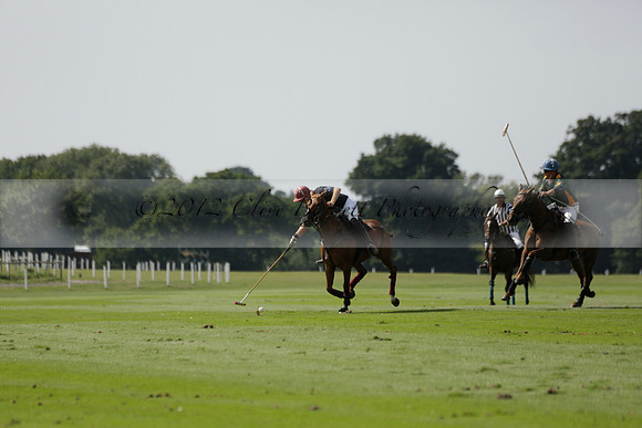 Maiz Dulce (green) v River (blue) in a Uber Polo Midsummer 12 goal polo match on Wednesday 21 August 2013 at Cowdray park Polo Club on Ambersham 2.  www.polopictures.co.uk