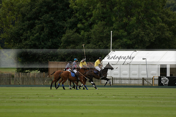 La Tremenda (lilac) v Maiz Dulce (yellow) in a Brecknock Cup polo match played on Lawns 1 at the Cowdray Park Polo Club on Tuesday 13 August 2013
