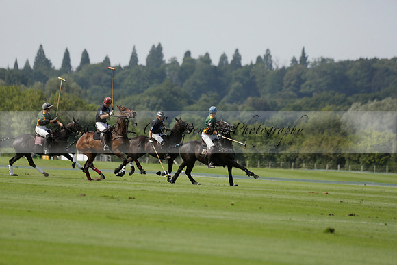 Maiz Dulce (green) v River (blue) in a Uber Polo Midsummer 12 goal polo match on Wednesday 21 August 2013 at Cowdray park Polo Club on Ambersham 2.  www.polopictures.co.uk