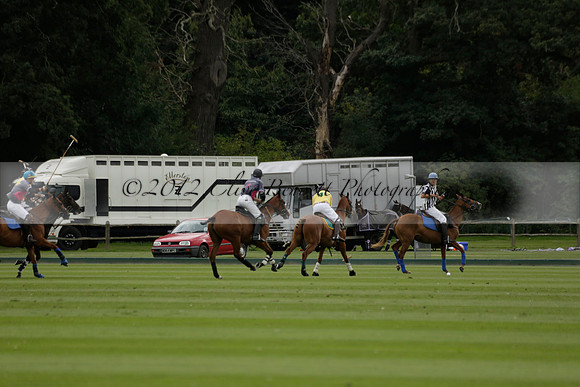 La Tremenda (lilac) v Maiz Dulce (yellow) in a Brecknock Cup polo match played on Lawns 1 at the Cowdray Park Polo Club on Tuesday 13 August 2013