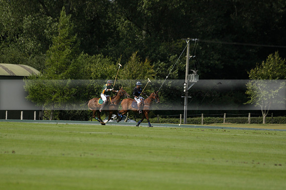 Maiz Dulce (green) v River (blue) in a Uber Polo Midsummer 12 goal polo match on Wednesday 21 August 2013 at Cowdray park Polo Club on Ambersham 2.  www.polopictures.co.uk