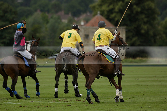 La Tremenda (lilac) v Maiz Dulce (yellow) in a Brecknock Cup polo match played on Lawns 1 at the Cowdray Park Polo Club on Tuesday 13 August 2013