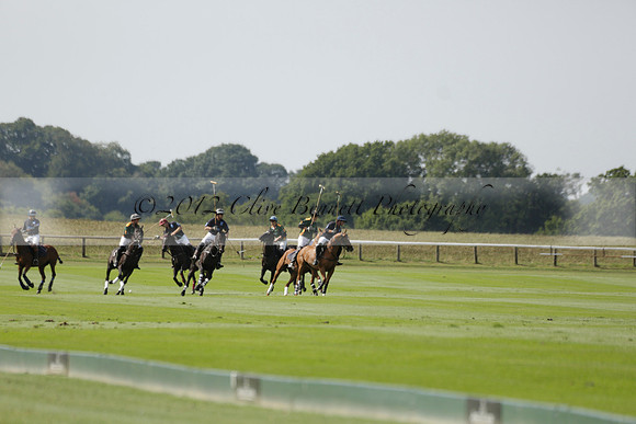 Maiz Dulce (green) v River (blue) in a Uber Polo Midsummer 12 goal polo match on Wednesday 21 August 2013 at Cowdray park Polo Club on Ambersham 2.  www.polopictures.co.uk