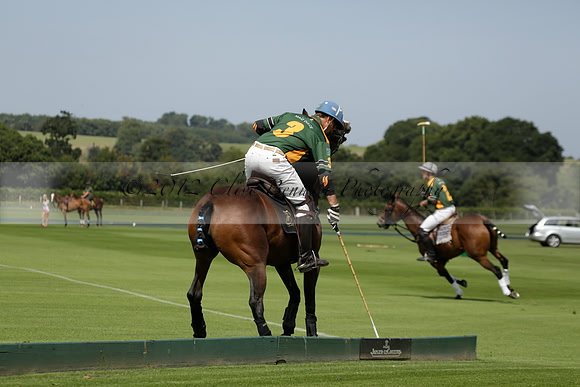 Maiz Dulce (green) v River (blue) in a Uber Polo Midsummer 12 goal polo match on Wednesday 21 August 2013 at Cowdray park Polo Club on Ambersham 2.  www.polopictures.co.uk